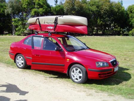 Kayak shown properly mounted on vehicle