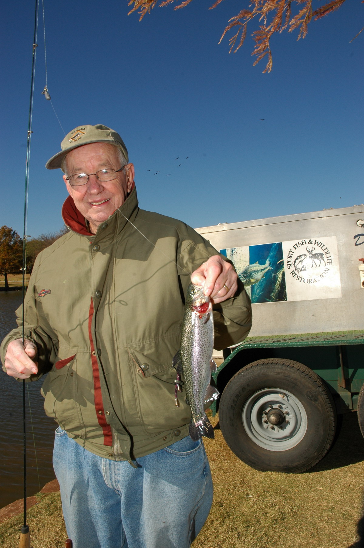 Angler with Rainbow Trout 